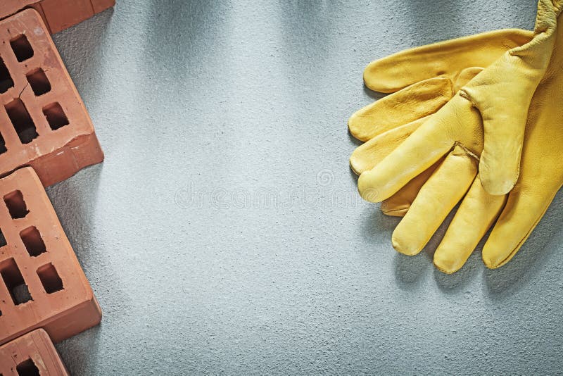 Samenstelling van oranje het leer beschermende glo van bouwbakstenen stock afbeeldingen Samenstelling van oranje het leer beschermende glo van bouwbakstenen stock afbeeldingen