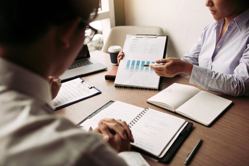 Group of usiness partnership coworkers working to chart company financial statements report and profits work progress and planning in office room. Group of usiness partnership coworkers working to chart company financial statements report and profits work progress and planning in office room.