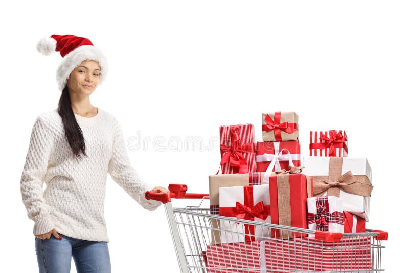 Samica w kapeluszu z santa claus z koszykiem pełnym prezentów zdjęcia royalty free