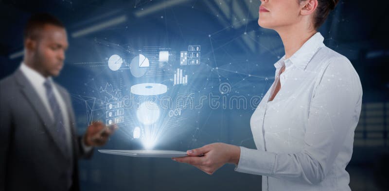 Businesswoman looking up while holding digital tablet against computer desks in the library. Businesswoman looking up while holding digital tablet against computer desks in the library