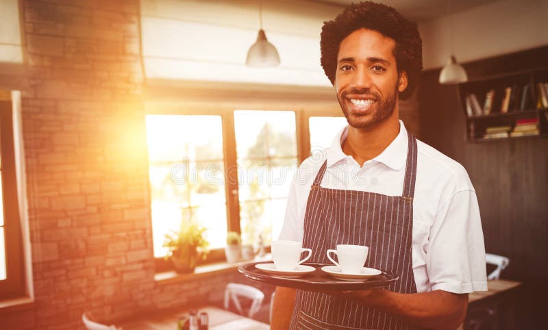 Waiter holding cup of coffee on a tray against empty chairs and tables. Waiter holding cup of coffee on a tray against empty chairs and tables