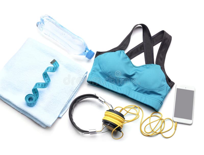 Sammansättning med sportswearen, mobiltelefon och mätaband på vit bakgrund royaltyfria bilder Sammansättning med sportswearen, mobiltelefon och mätaband på vit bakgrund royaltyfria bilder