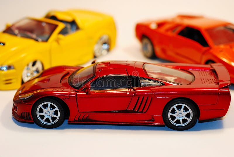 This is a shot of 3 toy cars. The focus is on the car in the fore ground. This is a shot of 3 toy cars. The focus is on the car in the fore ground.