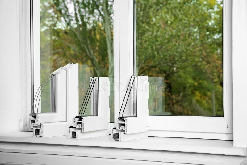 Samples of modern window profiles on sill, space for text. Installation service stock photography