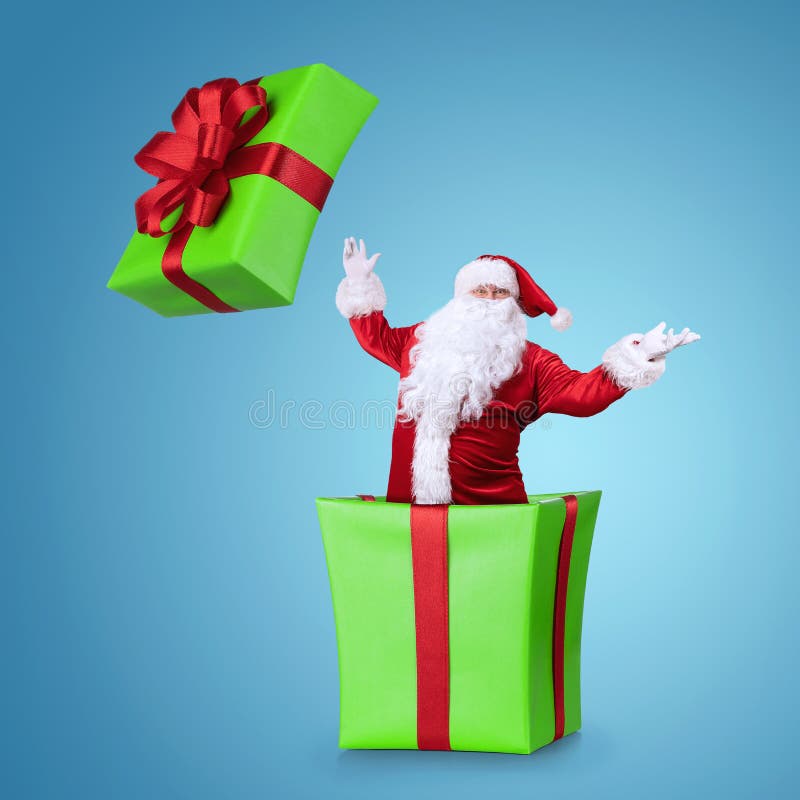 Samta Klaus Herausspringen des Weihnachtskastens stockbild Samta Klaus Herausspringen des Weihnachtskastens stockbild