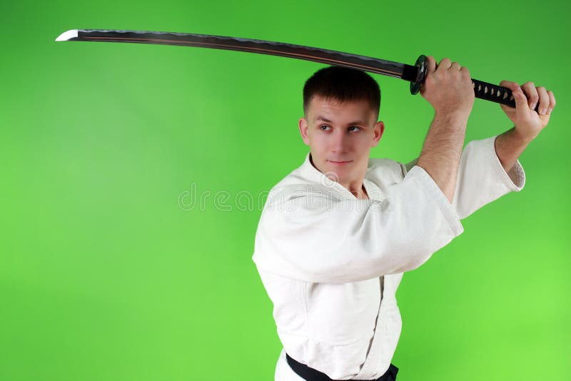 A Man, In A Black Kimono Is Practicing Martial Arts Technique With A Long  Bamboo Fighting Stick. Stock Photo, Picture and Royalty Free Image. Image  91980191.