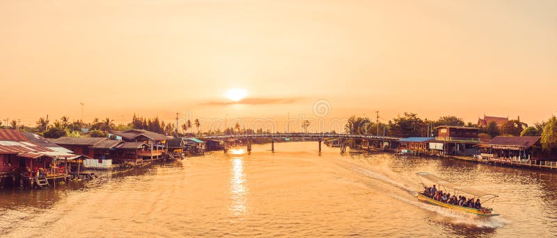 Samut Songkhram , Thailand - April 14, 2018: River cruise boats transporting people on the Mae Klong River. stock photos Samut Songkhram , Thailand - April 14, 2018: River cruise boats transporting people on the Mae Klong River. stock photos