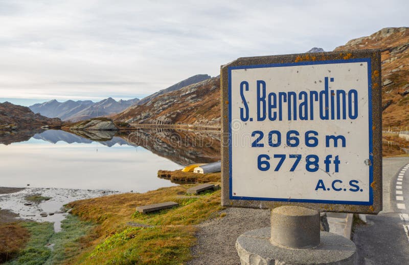 San Bernardino mountain pass, Switzerland. The sign with the altitude of the pass and the lake Moesola in the background stock images San Bernardino mountain pass, Switzerland. The sign with the altitude of the pass and the lake Moesola in the background stock images