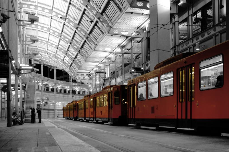 Trolley Station in San Diego with passengers waiting to get onboard.