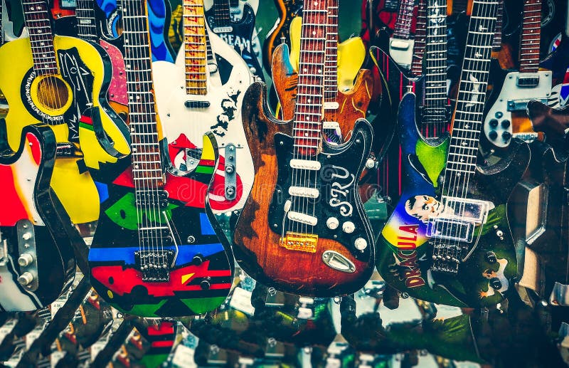 Many mini electric guitars small toy models background royalty free stock image Many mini electric guitars small toy models background royalty free stock image
