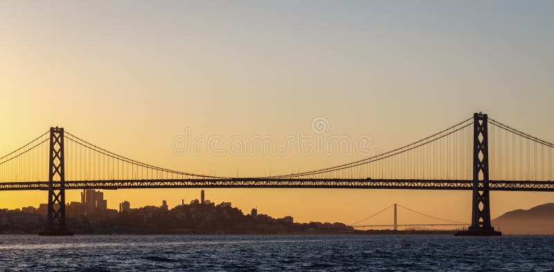 San Francisco Bay Bridge and Golden Gate bridge at sunset