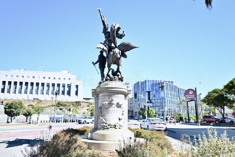 San Francisco California Volunteers Monument is a sculpture dedicated to the solders of the Spanish American War,of April through August 1898. Originally located on Van Ness Avenue at Market Street,the location was criticized as it made the statue,a granite base 10 feet (3 meters) tall holding the 16 foot (4.9 meter) tall by 10 foot (3 meter) long bronze sculpture look insignificant. This location,Dolores and Market Streets,was chosen as it really stands out much better. Although the figure riding the horse is supposed to be the ancient Roman Goddess Bellona,the Goddess of War,some people have thought it is Nike,the Greek Goddess of Victory. As seen 16 August 2023. San Francisco California Volunteers Monument is a sculpture dedicated to the solders of the Spanish American War,of April through August 1898. Originally located on Van Ness Avenue at Market Street,the location was criticized as it made the statue,a granite base 10 feet (3 meters) tall holding the 16 foot (4.9 meter) tall by 10 foot (3 meter) long bronze sculpture look insignificant. This location,Dolores and Market Streets,was chosen as it really stands out much better. Although the figure riding the horse is supposed to be the ancient Roman Goddess Bellona,the Goddess of War,some people have thought it is Nike,the Greek Goddess of Victory. As seen 16 August 2023.