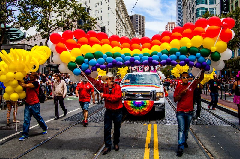 Mexican celebrating pride in San Francisco marching in the parade rainbow balloons. Mexican celebrating pride in San Francisco marching in the parade rainbow balloons