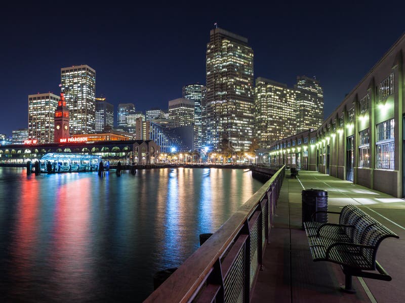 View of the San Francisco skyline at night from one of the piers. View of the San Francisco skyline at night from one of the piers.