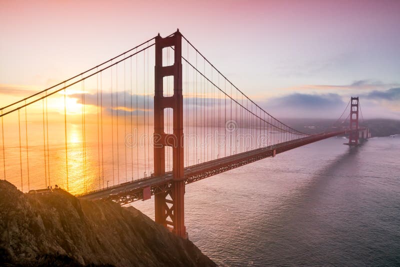 Panoramic view over the San Francisco Golden Bridge and bay area at down during sunrise. Photo taken from Battery Spencer, Sausalito, California CA, US. Panoramic view over the San Francisco Golden Bridge and bay area at down during sunrise. Photo taken from Battery Spencer, Sausalito, California CA, US