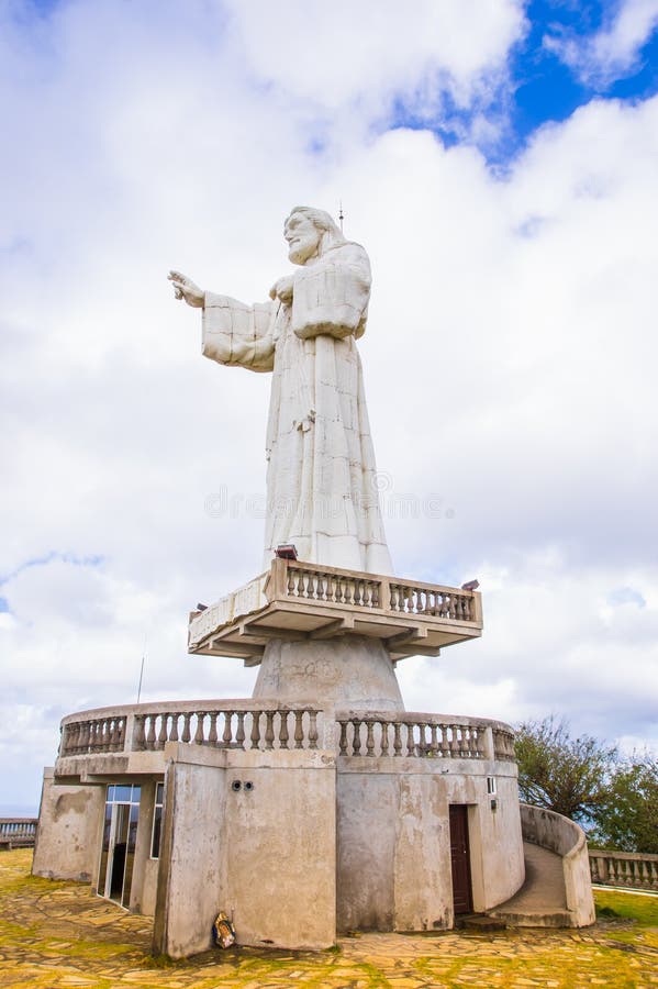 San Juan del Sur, Nicaragua - May 11, 2018: Colossal statue of Jesus Christ in the northernmost seawall in the bay of San Juan del Sur, Nicaragua. San Juan del Sur, Nicaragua - May 11, 2018: Colossal statue of Jesus Christ in the northernmost seawall in the bay of San Juan del Sur, Nicaragua.