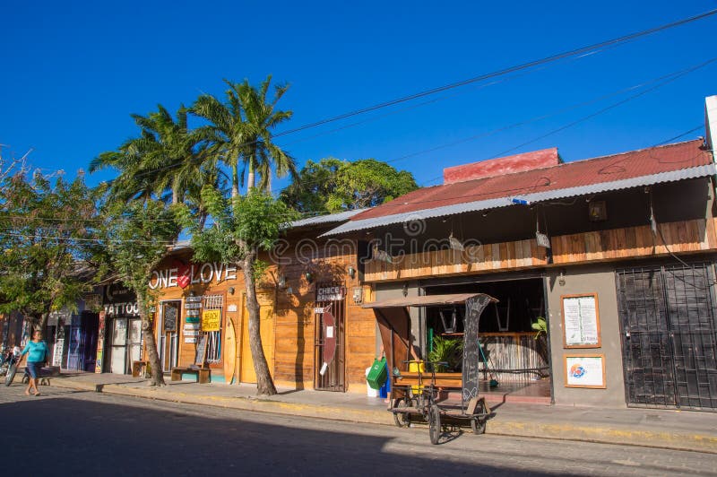 San Juan del Sur, Nicaragua - May 11, 2018: Outdoor view of houses in Juan del Sur, Nicaragua. It is main tourists destination and surfing capital in Nicaragua. San Juan del Sur, Nicaragua - May 11, 2018: Outdoor view of houses in Juan del Sur, Nicaragua. It is main tourists destination and surfing capital in Nicaragua.