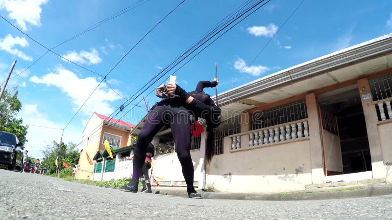 Gay fire breather dance on street