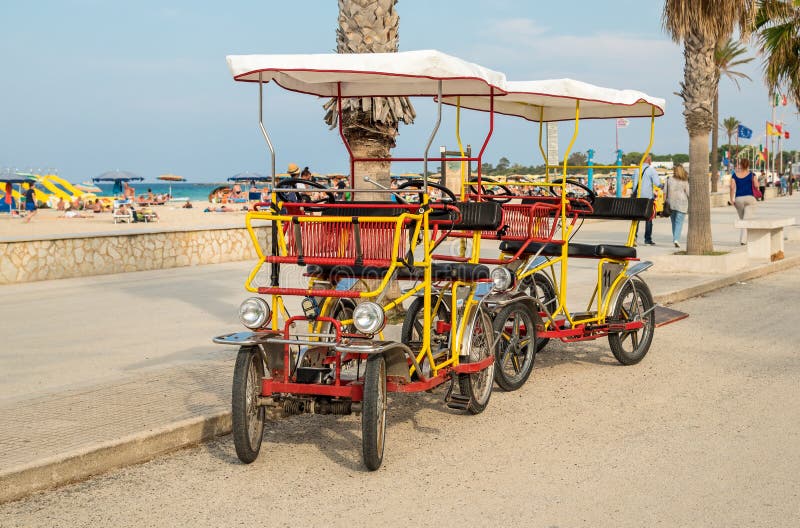 Rickshaw bicycle for rental for tourists parked near beach in San Vito Lo Capo. stock photography Rickshaw bicycle for rental for tourists parked near beach in San Vito Lo Capo. stock photography