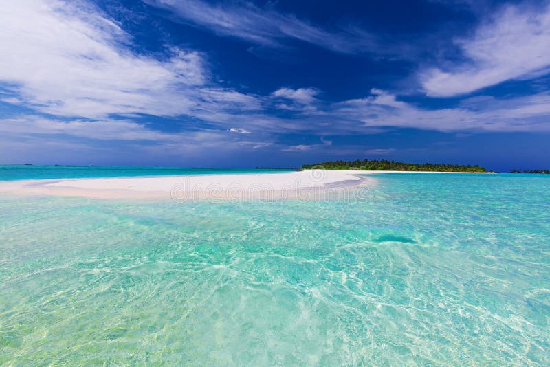 Sand Bar at the End of Tropical Island with Pristine Water Stock Photo
