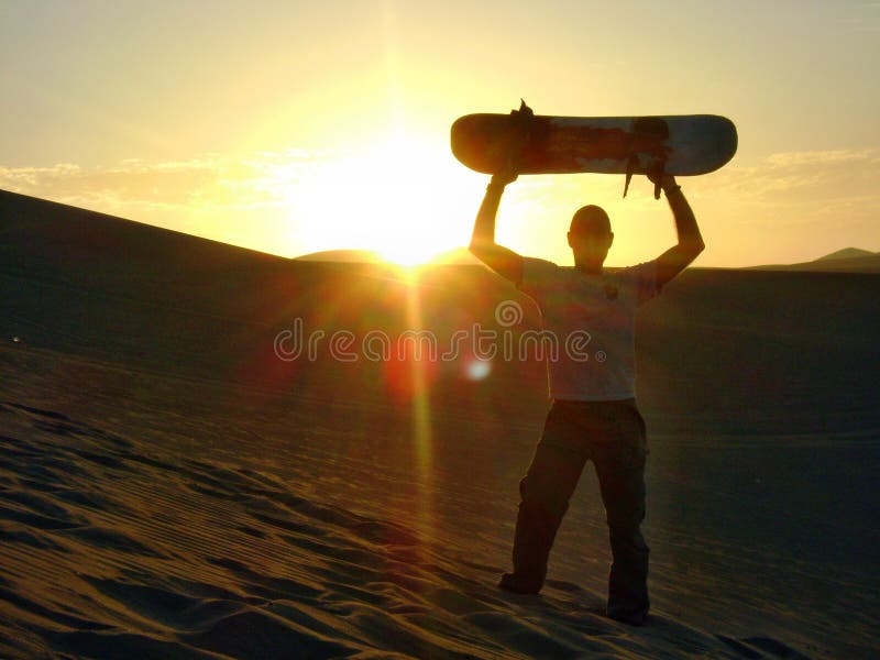 Sand boarding sunset