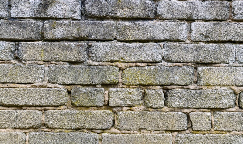 A sand brickstone wall as a architecture background. A sand brickstone wall as a architecture background