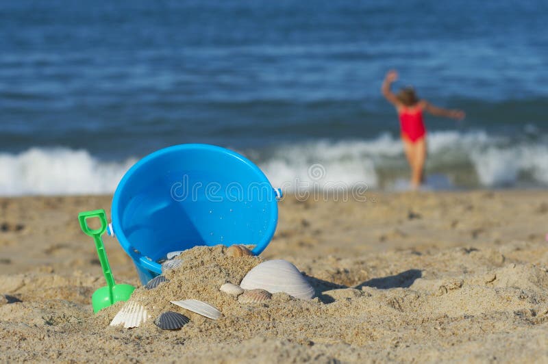Sand bucket on the beach stock photo. Image of play, spade 11318642