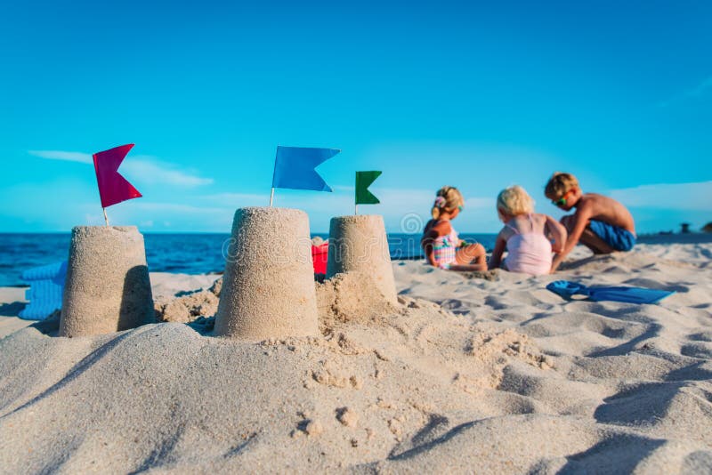 Sand Castle and Kids Play with Sand on Beach Stock Image Image of