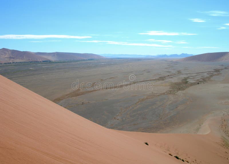 Lunar panoramic landscape with red sand dunes in the Kalahari Desert, Namibia, Africa