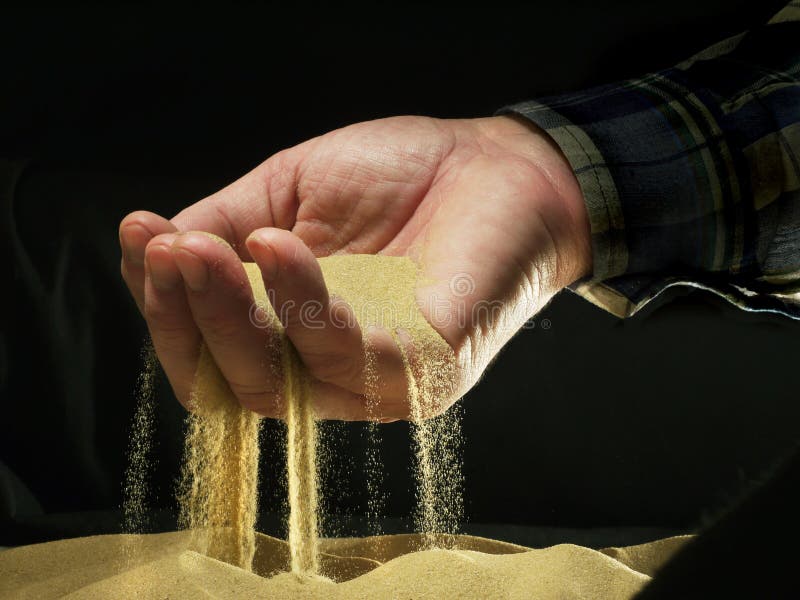 Sand through fingers