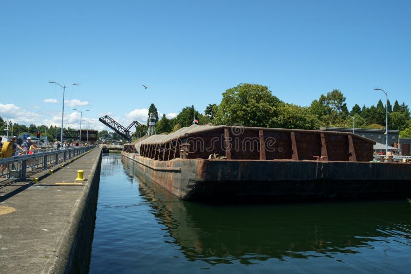 Sand and gravel barge in locks