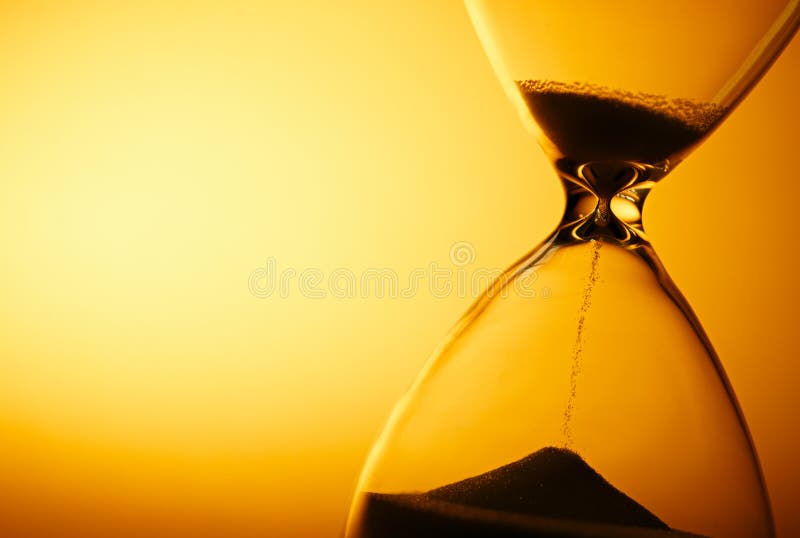 Sand passing through the bulbs of an hourglass