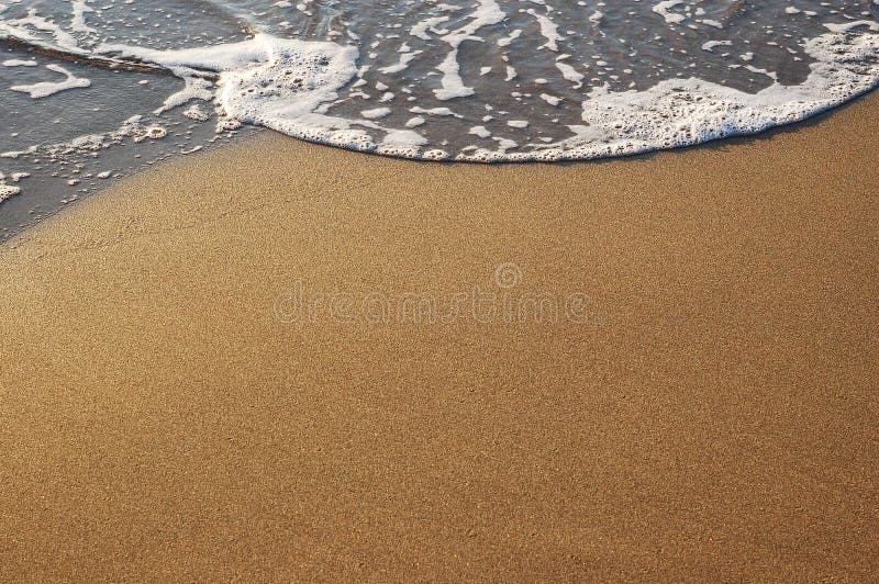 Sand and sea foam royalty free stock photos