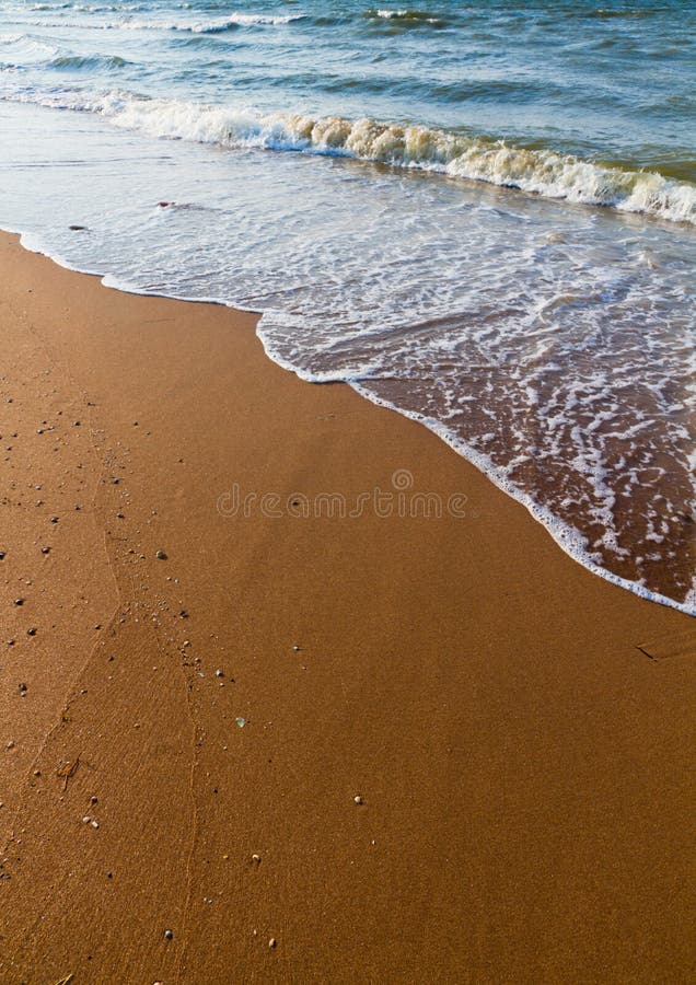 Sand and wave royalty free stock photo