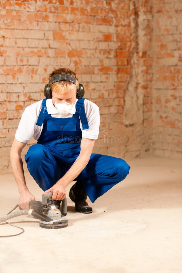 Sanding the cement floor stock image. Image of real, structure - 15874715