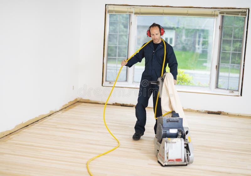 A Sanding Hardwood Floor with the Grinding Machine. Stock Photo Image