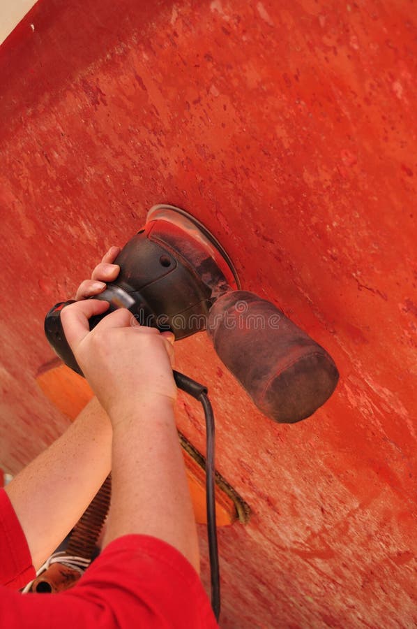 Sanding Sailboat Hull with a Random Orbital Sander Stock Photo Image