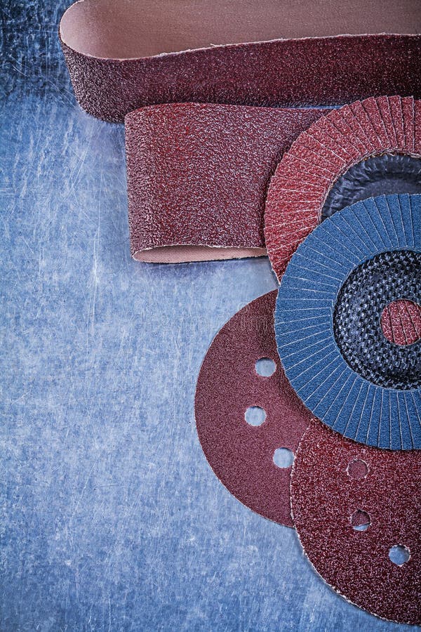 Sandpaper Abrasive Discs Flap Grinding Wheels on Metallic Backgr Stock