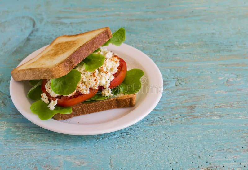 Sandwich with Egg, Tomato and Lettuce on a White Plate Stock Image
