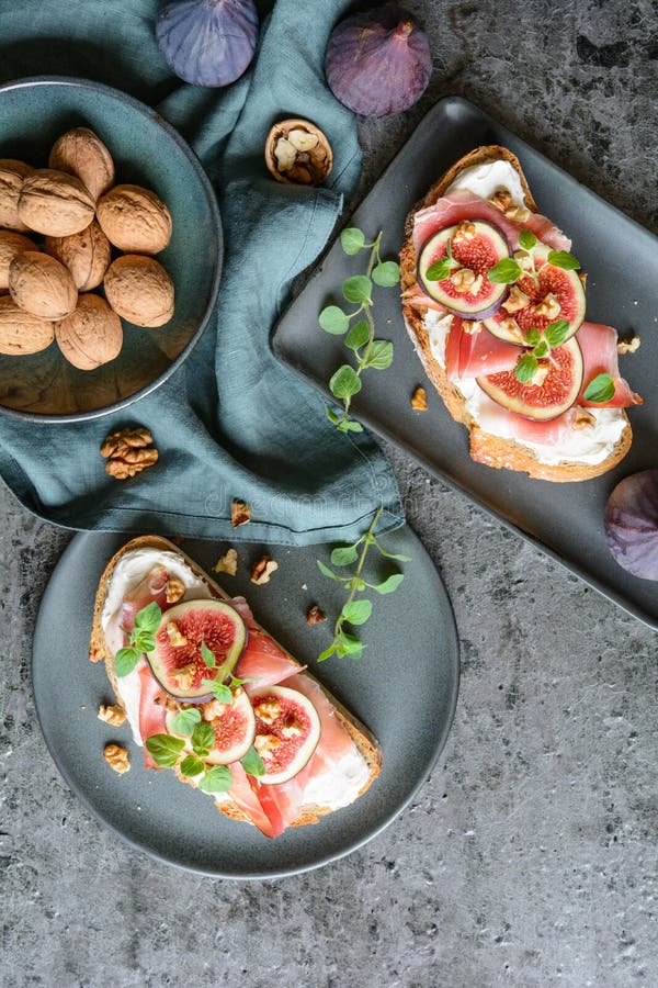 Prosciutto with Figs, Rosemary, and Red Olives in an Old Brass Dish