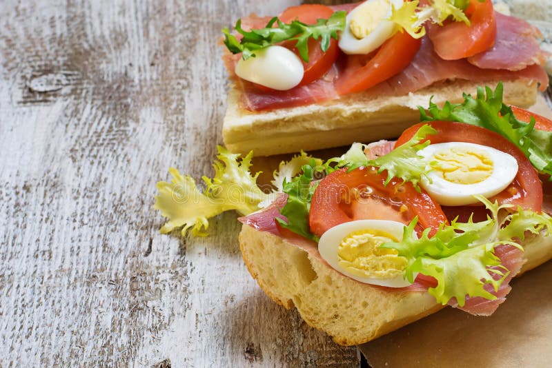 Sandwich with Ham, Salad, Eggs and Tomato Stock Photo Image of