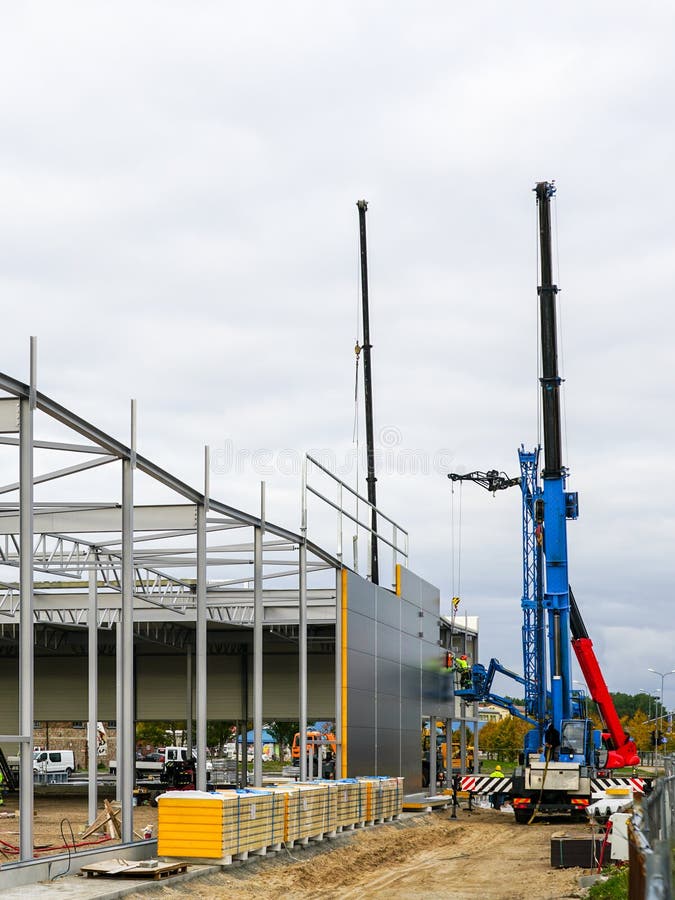 Sandwich Panel Wall Assembly on an Assembled Steel Frame of a New Warehouse Building Stock Image