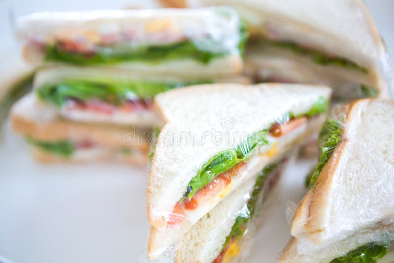 Sandwich in plastic wrap stock image. Image of green 51380047