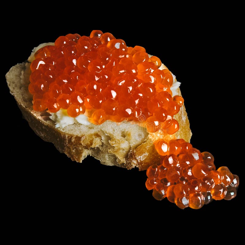 Sandwich with red caviar from white fresh bread with butter,isolated on a black background,seafood from fish,healthy fish oil delicacies for rich people,vitamins for hair, delicious food,festive table