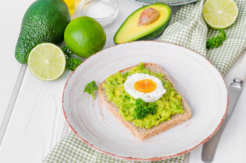 Sandwich with Whole Grain Bread, Mashed Avocado and Boiled Eggs Stock