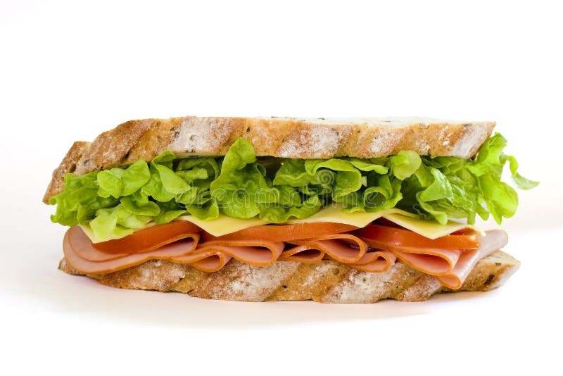 Sliced virginian ham sandwich on gourmet multi-grain bread together with tomatoes, cheese and lettuce. Sliced virginian ham sandwich on gourmet multi-grain bread together with tomatoes, cheese and lettuce