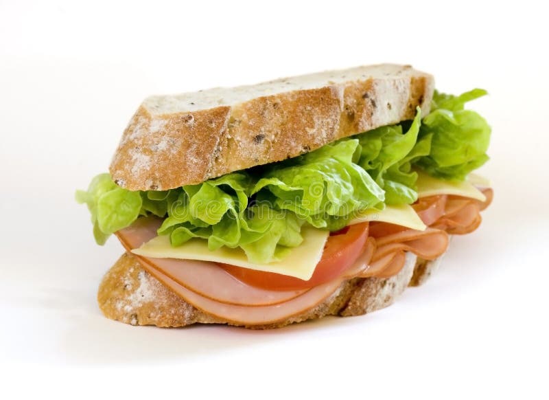 Sliced virginian ham sandwich on gourmet multi-grain bread together with tomatoes, cheese and lettuce. Sliced virginian ham sandwich on gourmet multi-grain bread together with tomatoes, cheese and lettuce