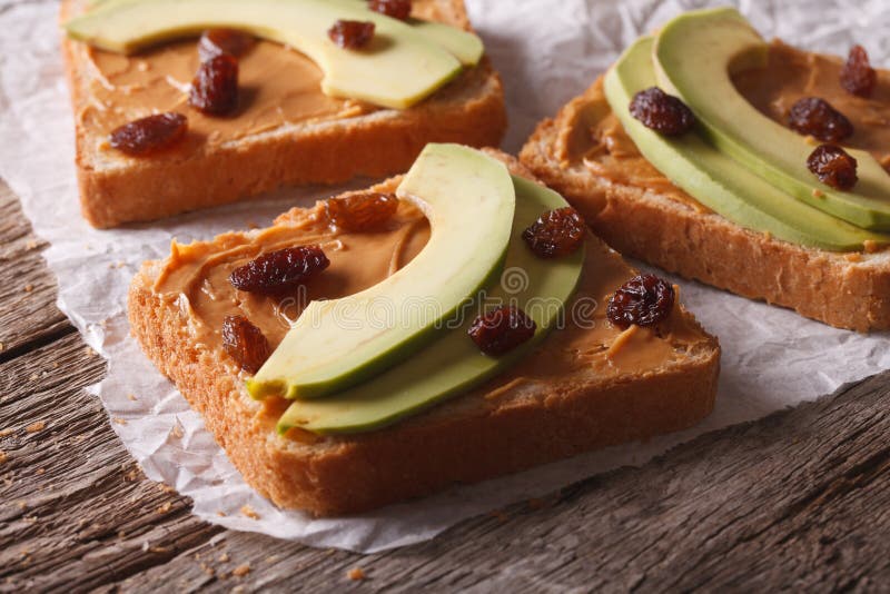 Sandwiches with Avocado, Peanut Butter and Raisins Closeup Stock Photo
