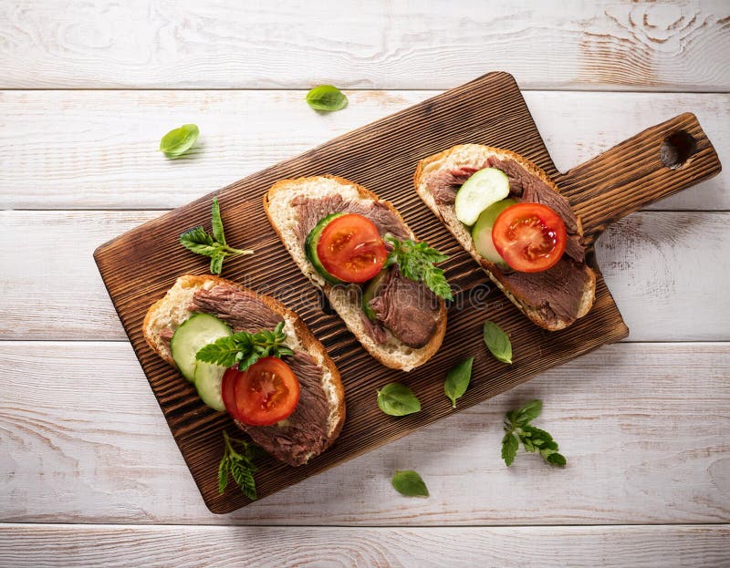 Sandwiches with beef, fresh vegetables and herbs on rustic wooden chopping board over white wood backdrop, top view. vector illustration