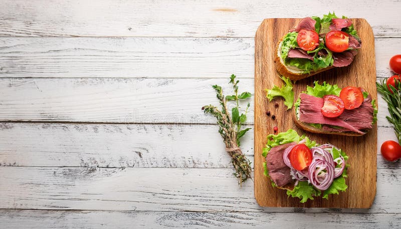 Sandwiches with beef, fresh vegetables and herbs on rustic wooden chopping board over white wood backdrop, top view. stock illustration